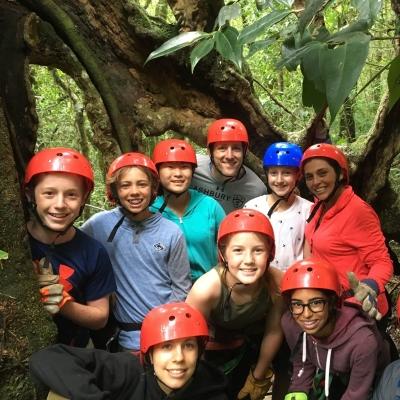 Middle school students take a group photo before they go zip lining in Costa Rica Projects Abroad volunteer prepare for their ziplining experience through the Costa Rican forest